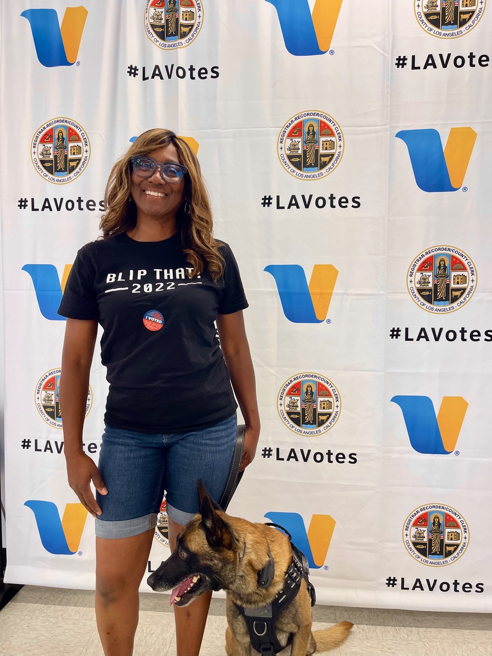 Daphne Bradford in a BLIP That campaign tee at a Los Angeles voting event.