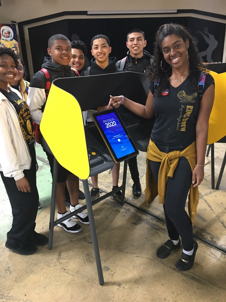 High school students casting their first votes at an LA County vote center.